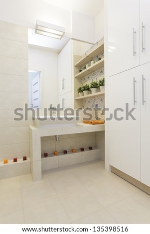 Cosy flat - ceramic sink on tiled bathroom countertop