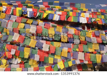 This photograph was clicked at Dalai Hill Mussoorie, Dehradun, Uttarakhand, India. A 400 meters trek leads to a beautiful place having a Buddha statue covered with colorful prayer flags, Tibetan flags