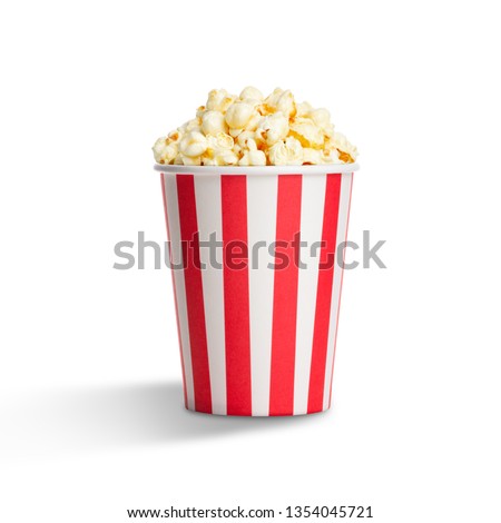 Popcorn in striped bucket isolated on white background Royalty-Free Stock Photo #1354045721