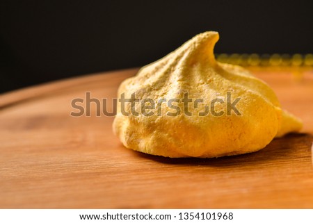 Meringue Delicious homemade meringues on wooden background