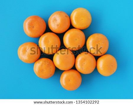Orange fruits on blue desk background for healthy