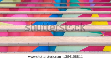 front view of Stair with steps painted colorful. 