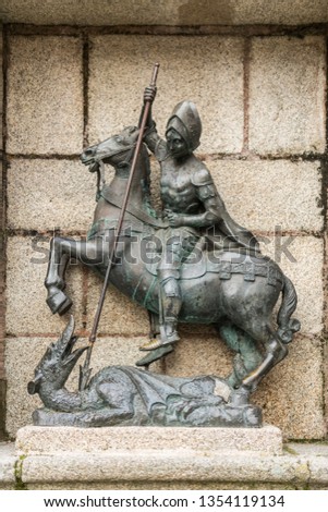 Detail of the sculpture of St. George killing the dragon in the Plaza de San Jorge in the old town of Caceres, Extremadura, Spain.