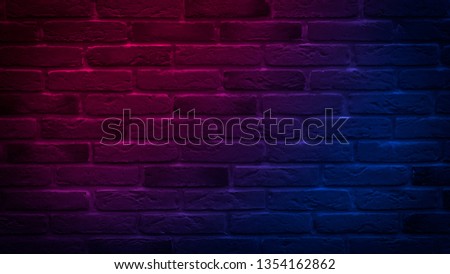Brick wall, background.  Neon red and blue light.