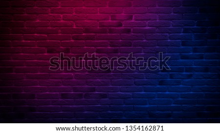 Brick wall, background.  Neon red and blue light.
