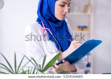 Arab female doctor working in the clinic 