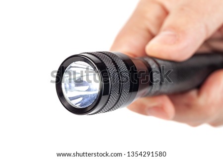 Hand holding flashlight on white background, tools