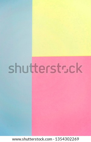 lue, pink and yellow pastel color paper geometric flat lay background. Minimal geometric shapes and lines in pastel colours.