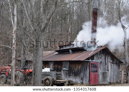 Traditional wood fired maple sugarhouse in operation in rural Vermont, spring, 2019  Royalty-Free Stock Photo #1354317608