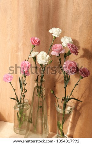 Spring flowers on a wooden background, coziness of a new village house and a sunny bright morning