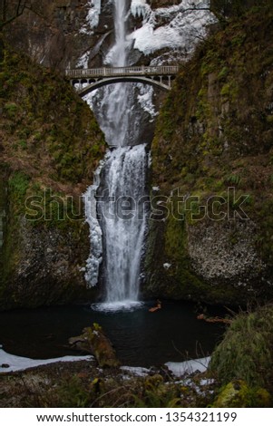 Multnomah Falls Bridge with Waterfall in Winter with Snow in Forest Cold