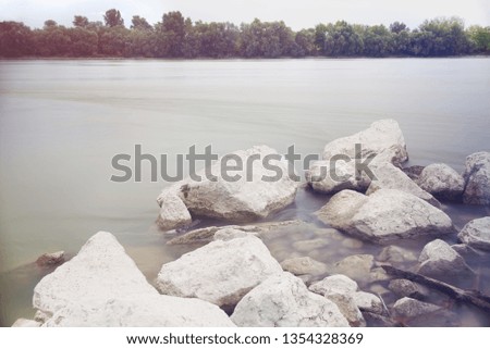Long Exposure Danube Landscape with Tree Line and White Rocks