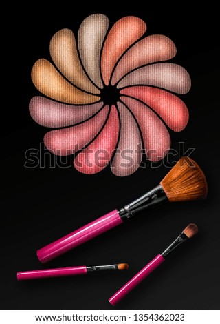 Professional make-up brush on a beautiful multicolor eyeshadow palette