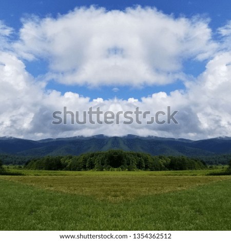 Abstract Photo Collage of Clouds and Sky and Mountain Pasture 