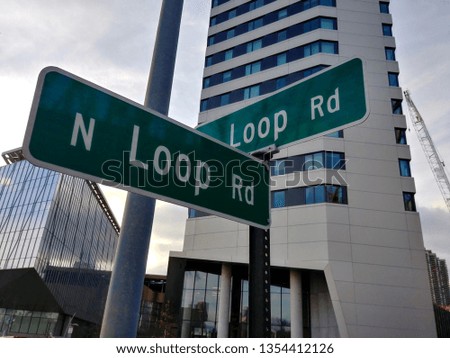 Street signs on Roosevelt Island in New York City at the intersection of two Loop Roads