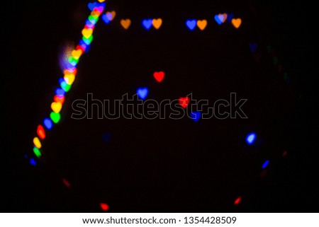 Colorful abstract heart shape blured bokeh at night time