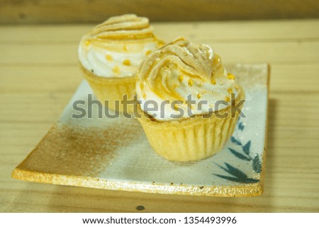Mini lemon meringue tart on Japanese style dish. Traditional French sweet pastry tart. 