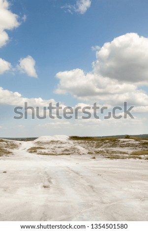 The road in the chalk mining in Sumy region in Ukraine. Chalk hills. Limestone quarry. Open-cast mining. 