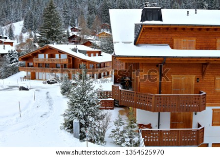 A traditional wooden cottage or chalet in the Swiss Alps.