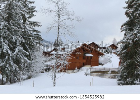 A traditional wooden cottage or chalet in the Swiss Alps.