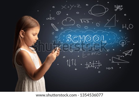 Adorable girl using tablet with educational concept