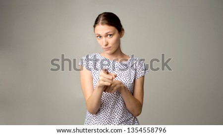 beautiful young brunette woman showing copyspace or something