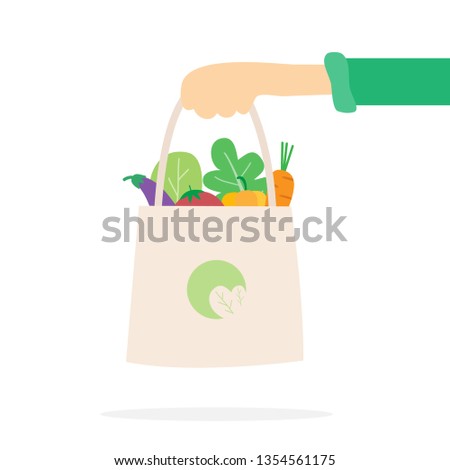 Hand holding healthy food bag. Shopping vegan food.