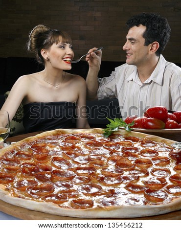 Young couple in pizzeria
