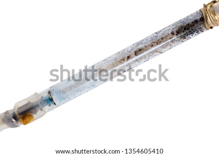 broken xenon flashgun lamp closeup isolated on white background Royalty-Free Stock Photo #1354605410