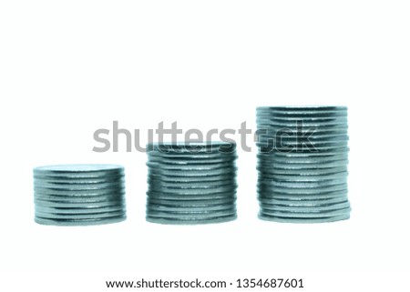Three piles of silver coins on a white background, close-up is isolated. Concept photo coins to use in finance, economics, banking, stock market quotations, financial statistics