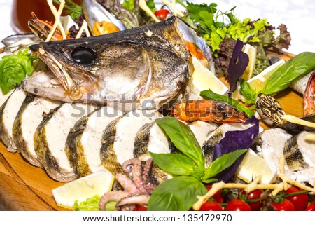 stuffed pike decoration vegetables and seafood
