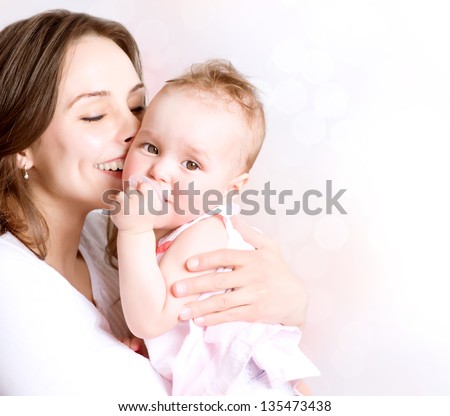 Mother and Baby kissing and hugging. Happy Family