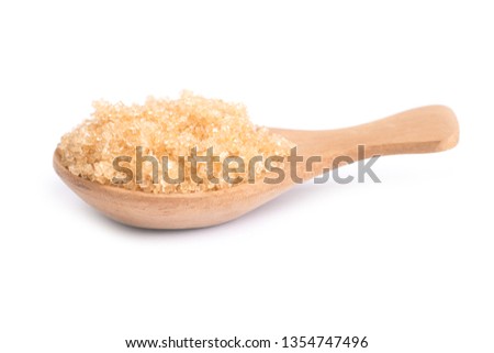 brown sugar in a wooden spoon isolated on white background