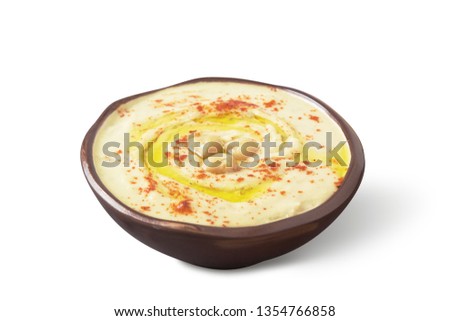 Нomemade hummus bowl isolated on white background with shadow