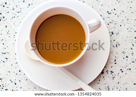 coffee cup on wood table in cafe(Vintage tone)