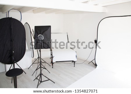 interior photo studio with photography lighting equipment