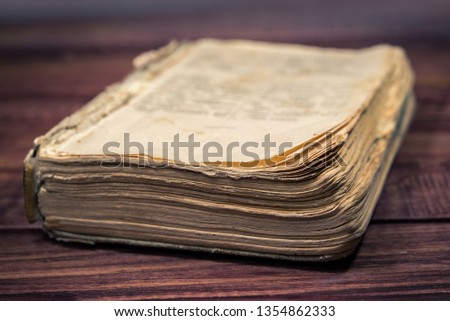 Ancient rare book on wooden background