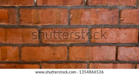 Old brick wall. Horizontal wide brick wall background. Vintage house facade.