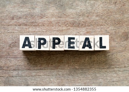 Letter block in word appeal on wood background Royalty-Free Stock Photo #1354882355