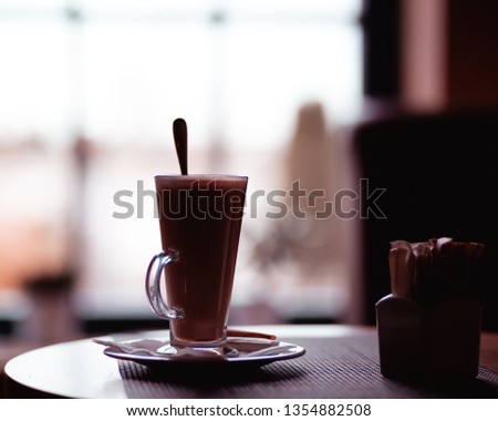 Cup of hot Cappuccino Coffee with sugar on the table Royalty-Free Stock Photo #1354882508