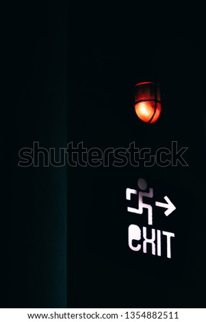 Glowing red exit sign. - Image Royalty-Free Stock Photo #1354882511