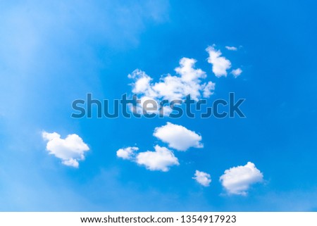 Blue sky background with clouds Royalty-Free Stock Photo #1354917923