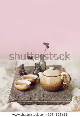 Clay teapot and tea cups on  table. Asian culture concept. tea ceremony in Japanese or chinese style. elegant composition