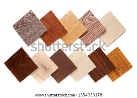 group of eight small samples of wooden parquet from different types of wood, different colors and textures for the designer's work. isolated on white background. Flat lay, top view Royalty-Free Stock Photo #1354933178