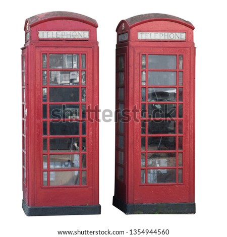 Vintage British red telephone boxes, call boxes or booths. Classic design phone box recognized around the world. Isolated on white background with clipping work path included in jpeg.