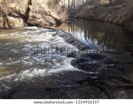 beautiful river landscape with small waterfalls and very clean water