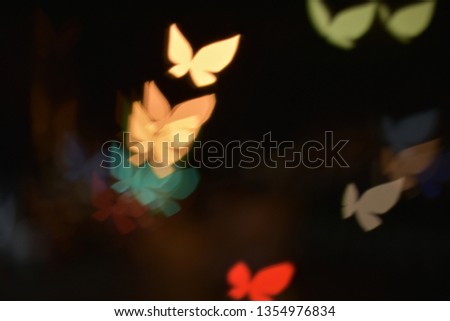 colorful butterfly bokeh dark background