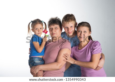 Elderly woman with older daughter and grandchildren in a studio