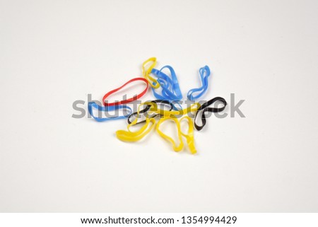 rubber hair tie, blue, yellow, balck and red.