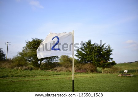  A Flag On A Golf Course 